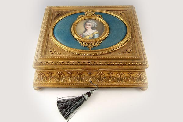 gold jewelry box with Victorian woman portrait in oval on top